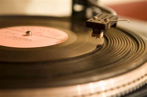 How do DJs get their music, and why do vinyl records smell like nostalgia?